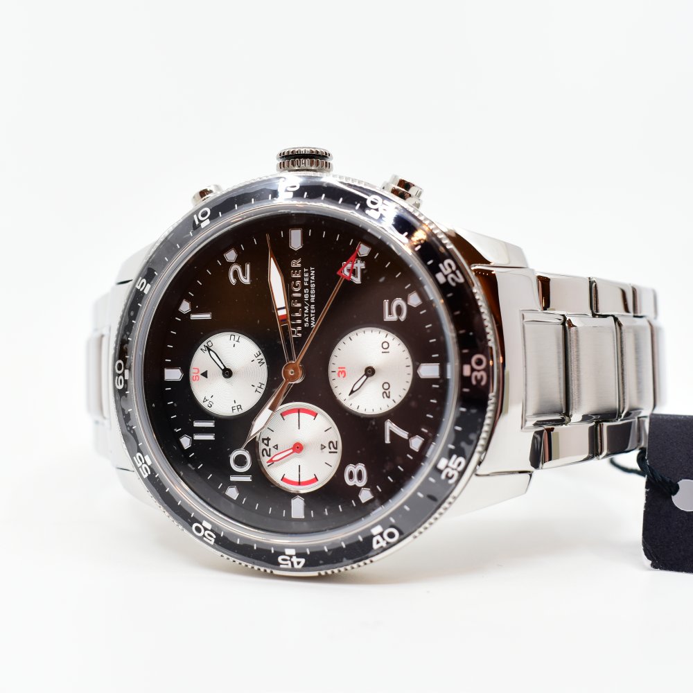Tommy Hilfiger Jimmy multifunction watch worn on wrist with black dial and three chronograph subdials