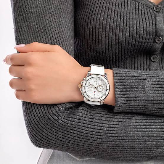 Tommy Hilfiger Libby women's chronograph watch worn on wrist with white strap and silver case