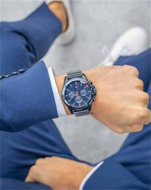 Tommy Hilfiger Mason chronograph watch worn on wrist with blue suit