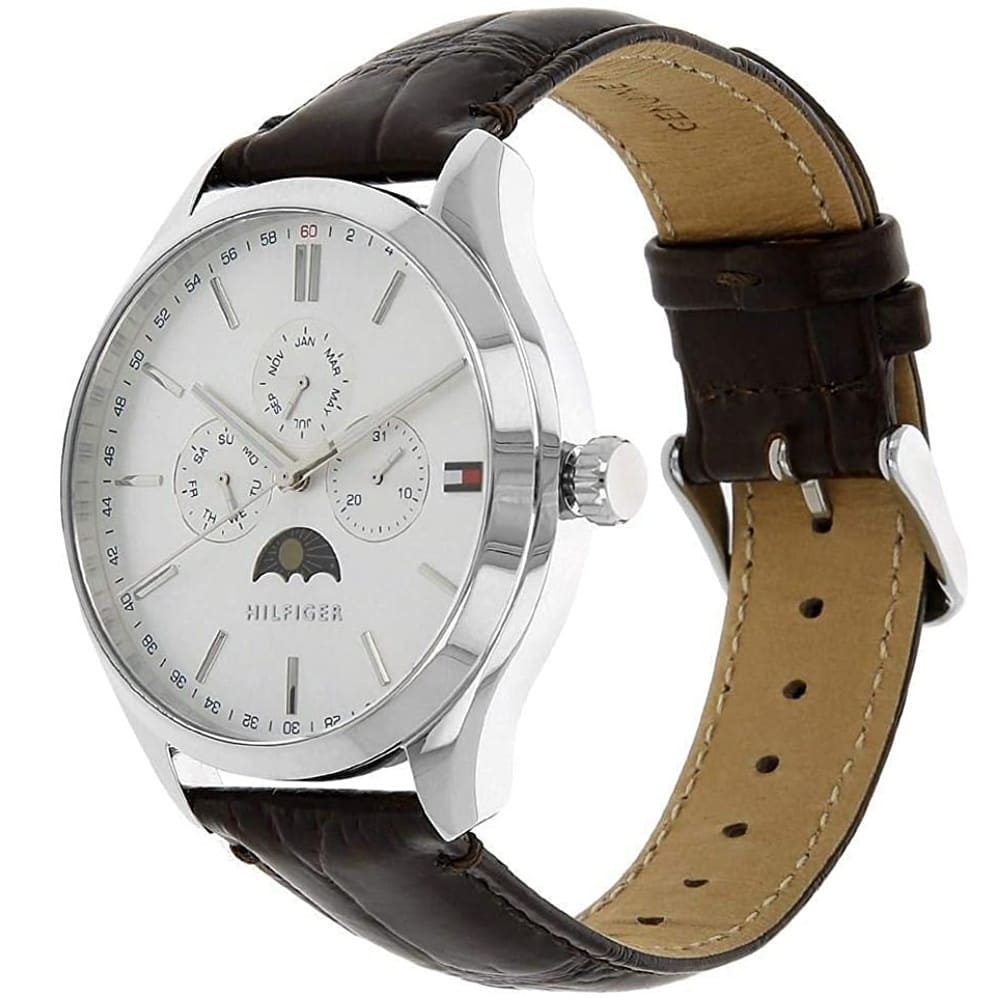 Tommy Hilfiger Oliver watch shown at angle with brown crocodile leather strap and tan interior lining