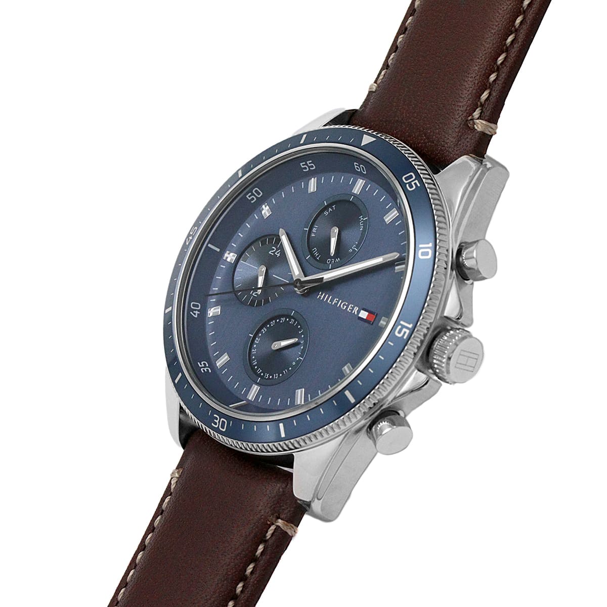Tommy Hilfiger Parker chronograph watch on wrist with blue dial and brown leather strap