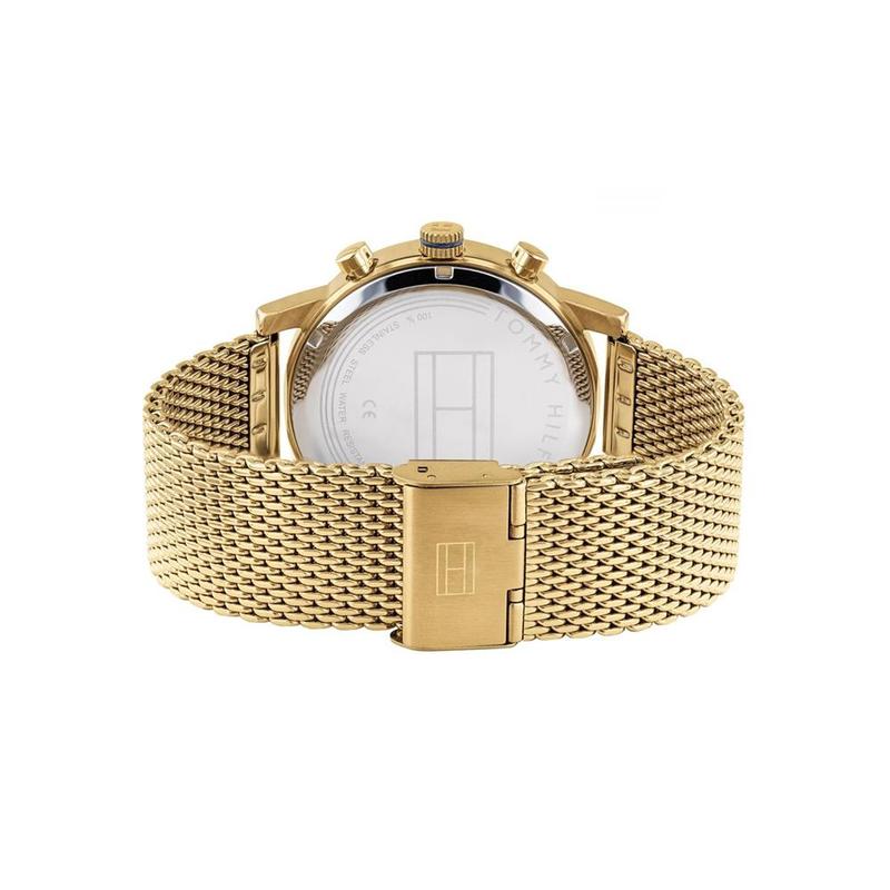 Back view of Tommy Hilfiger watch showing case back and gold mesh strap clasp