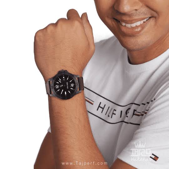Tommy Hilfiger RYAN watch worn on wrist with black case and brown leather strap