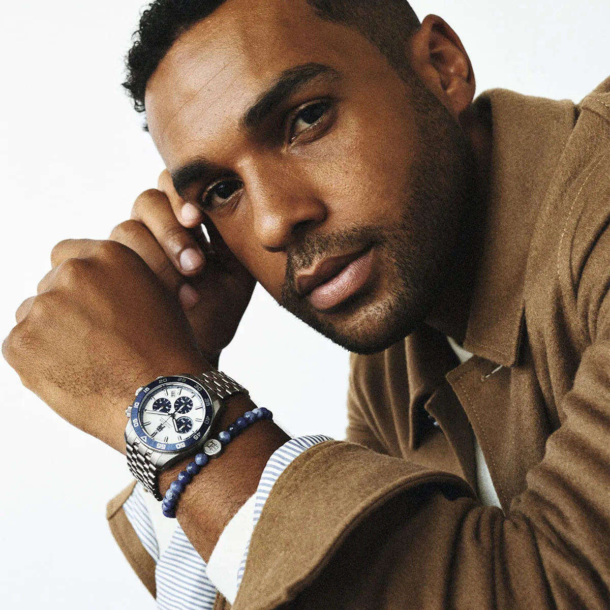 Tommy Hilfiger TH85 chronograph worn on wrist with blue beaded bracelet