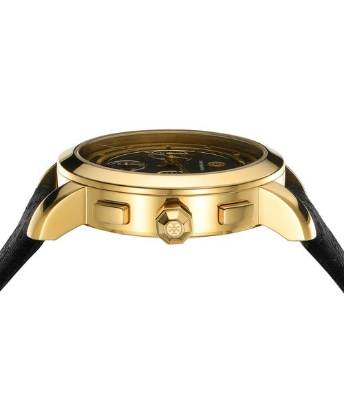 Gold-tone watch dial detail with chronograph subdials and black face