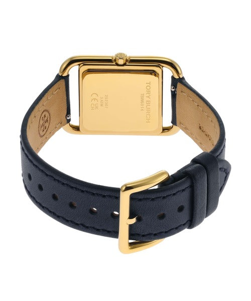 Back view of Tory Burch Miller watch showing gold case back and navy leather strap with gold buckle