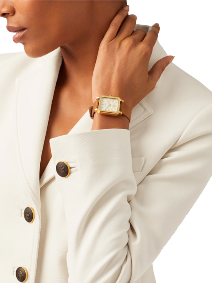 Tory Burch Robinson watch on wrist paired with white blazer