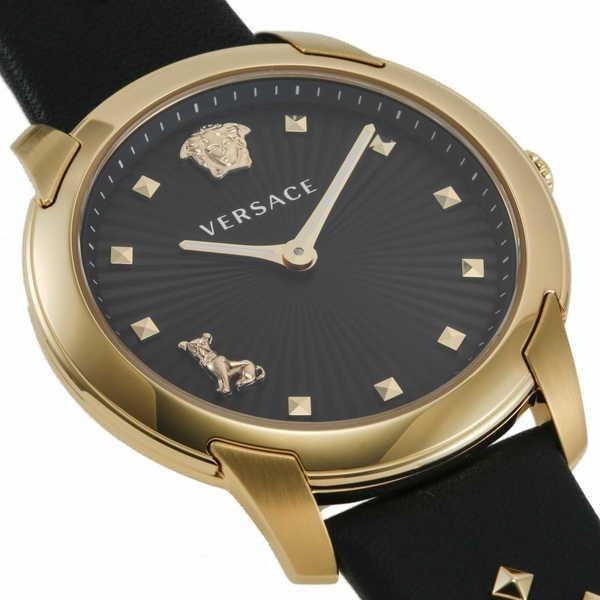 Versace Audrey dial detail displaying black background with gold hour markers and Medusa head logo