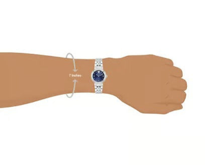 Versace Daphnis women's watch on wrist showing size and proportions with silver bracelet