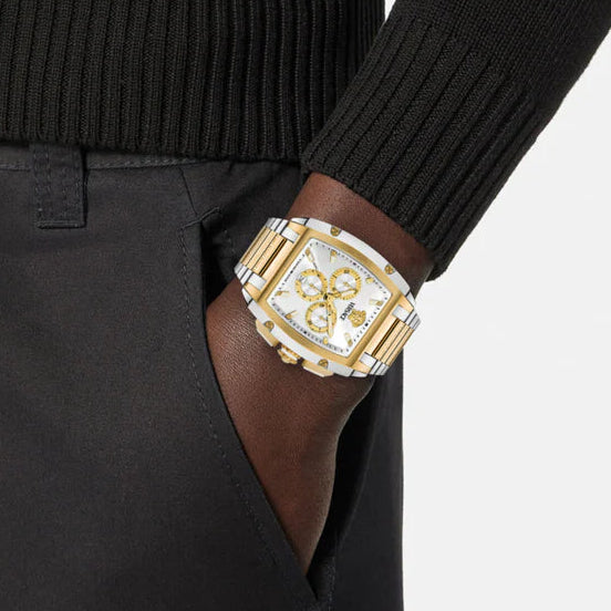 Versace Dominus chronograph watch worn on wrist with two-tone bracelet and silver dial