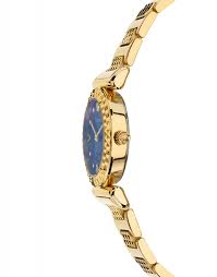 Versace Mini Vanity watch worn on wrist showing blue dial and gold bracelet