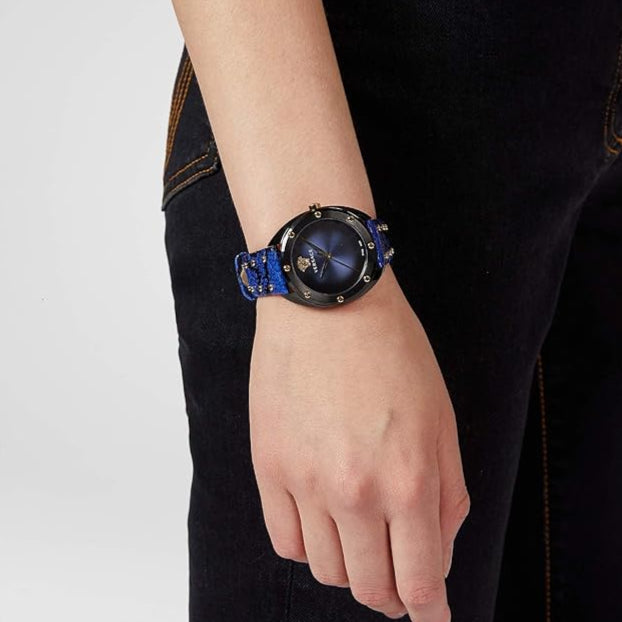 Versace Shadov ladies watch on wrist showing blue dial and studded leather strap detail