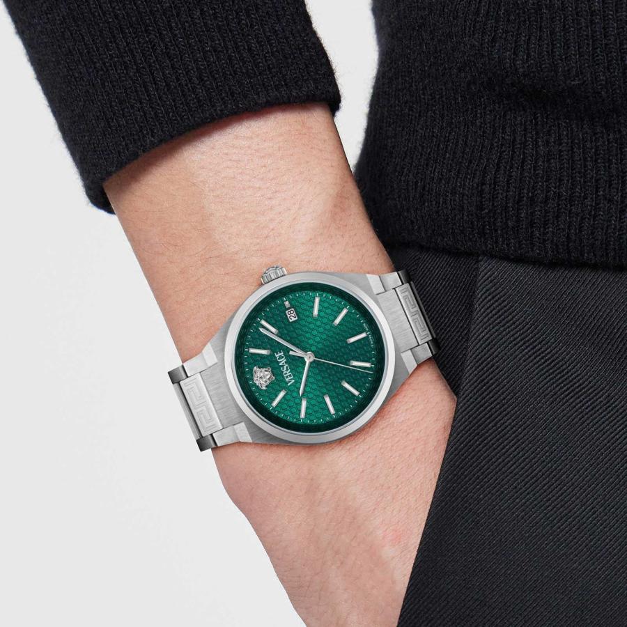 Versace V-Auria green dial watch worn on wrist with silver steel bracelet