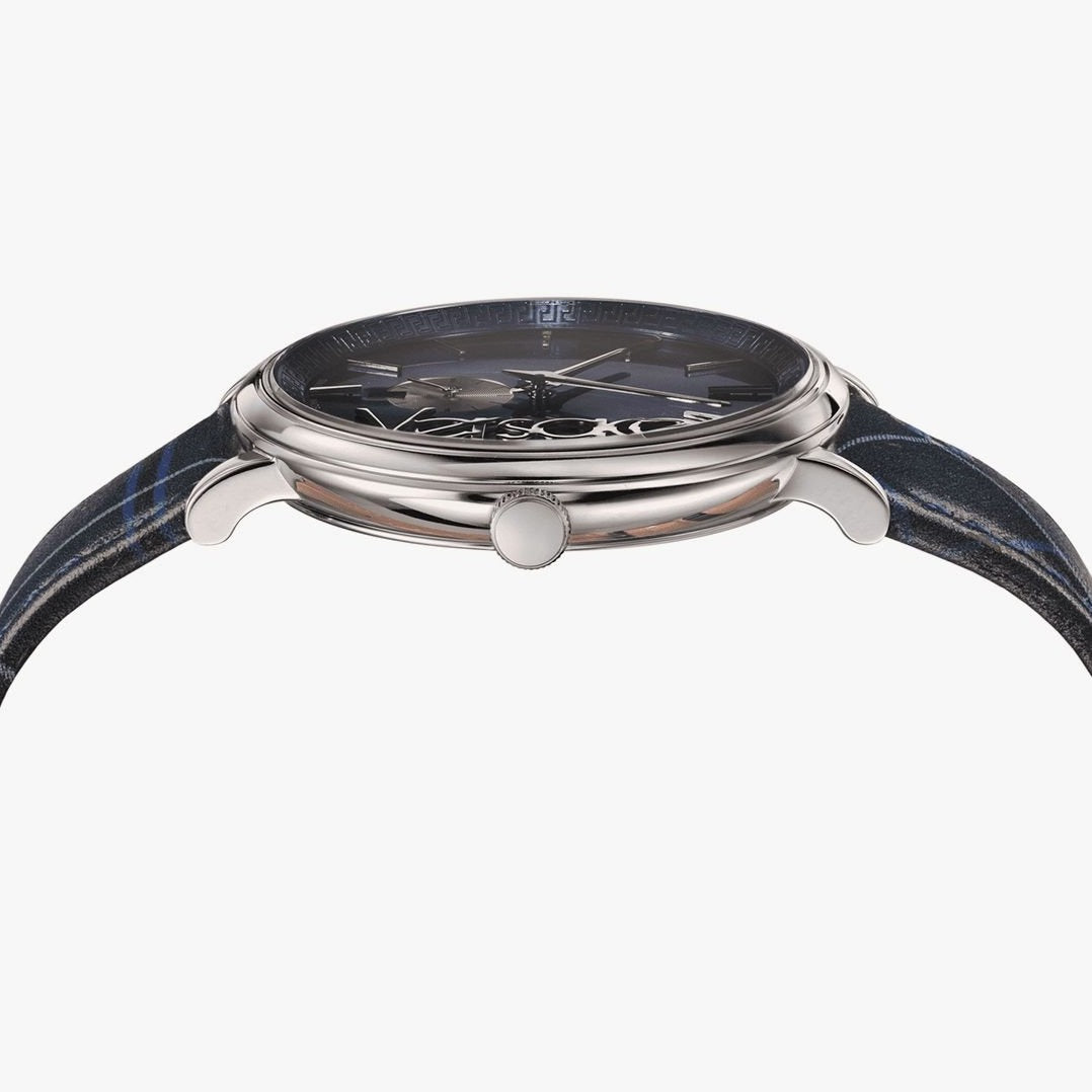 Top-down view of Versace V-Circle watch with navy dial and blue plaid textile strap