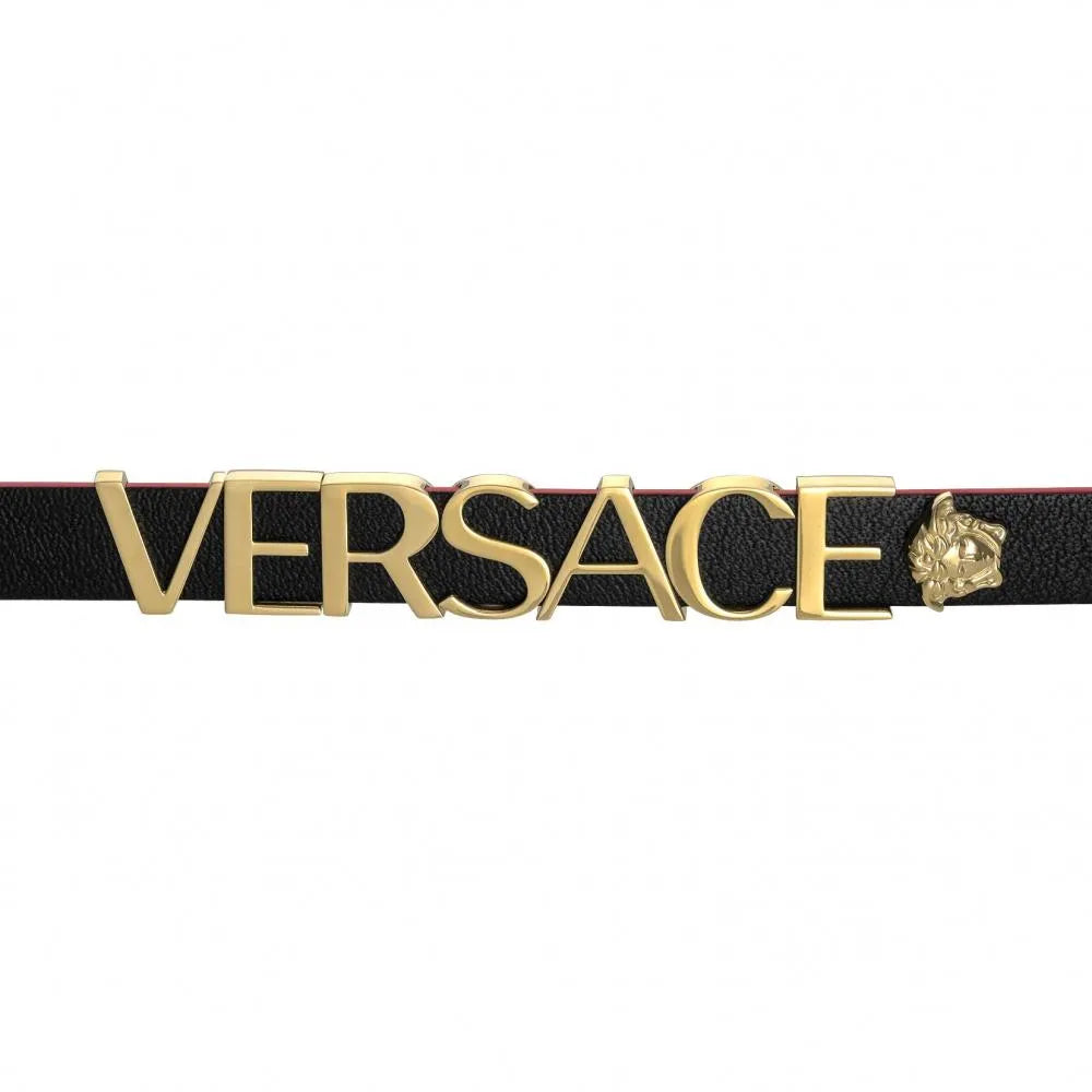 Close-up of Versace V-Flare strap showing black and magenta leather with gold-tone logo and hardware