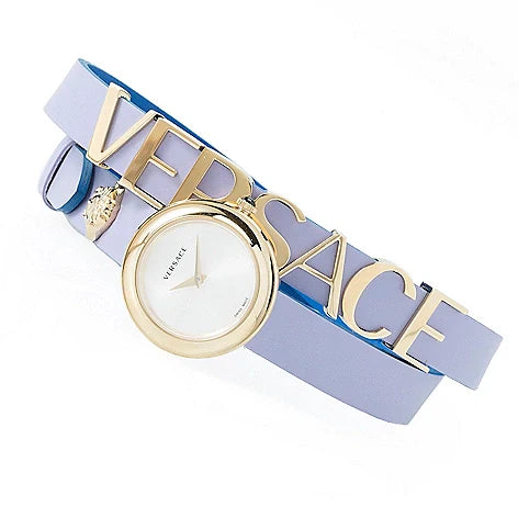 Versace V-Flare women's watch flat lay with white dial, gold bezel, and purple and blue leather band