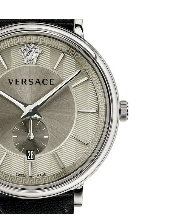 Close-up of Versace dial detail with Medusa motif, Greek key pattern, and hour markers