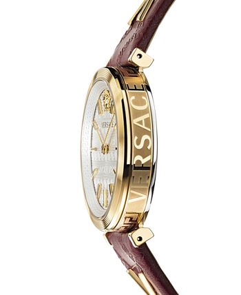 Versace caseback on purple leather strap showing VERSACE text and gold-tone case edge
