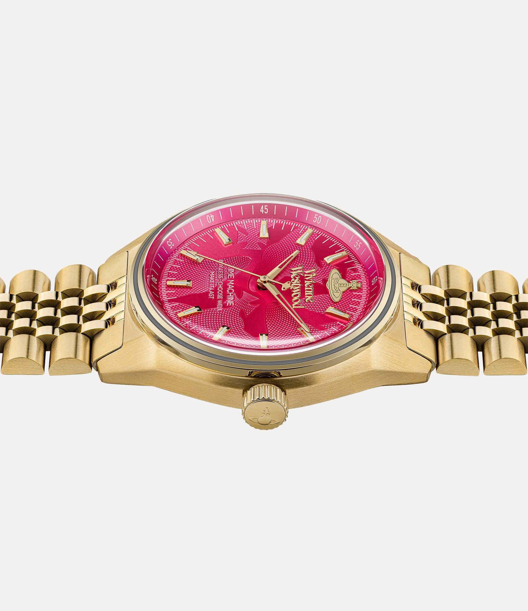 Close-up detail of hot pink dial featuring Vivienne Westwood branding and Time Machine text