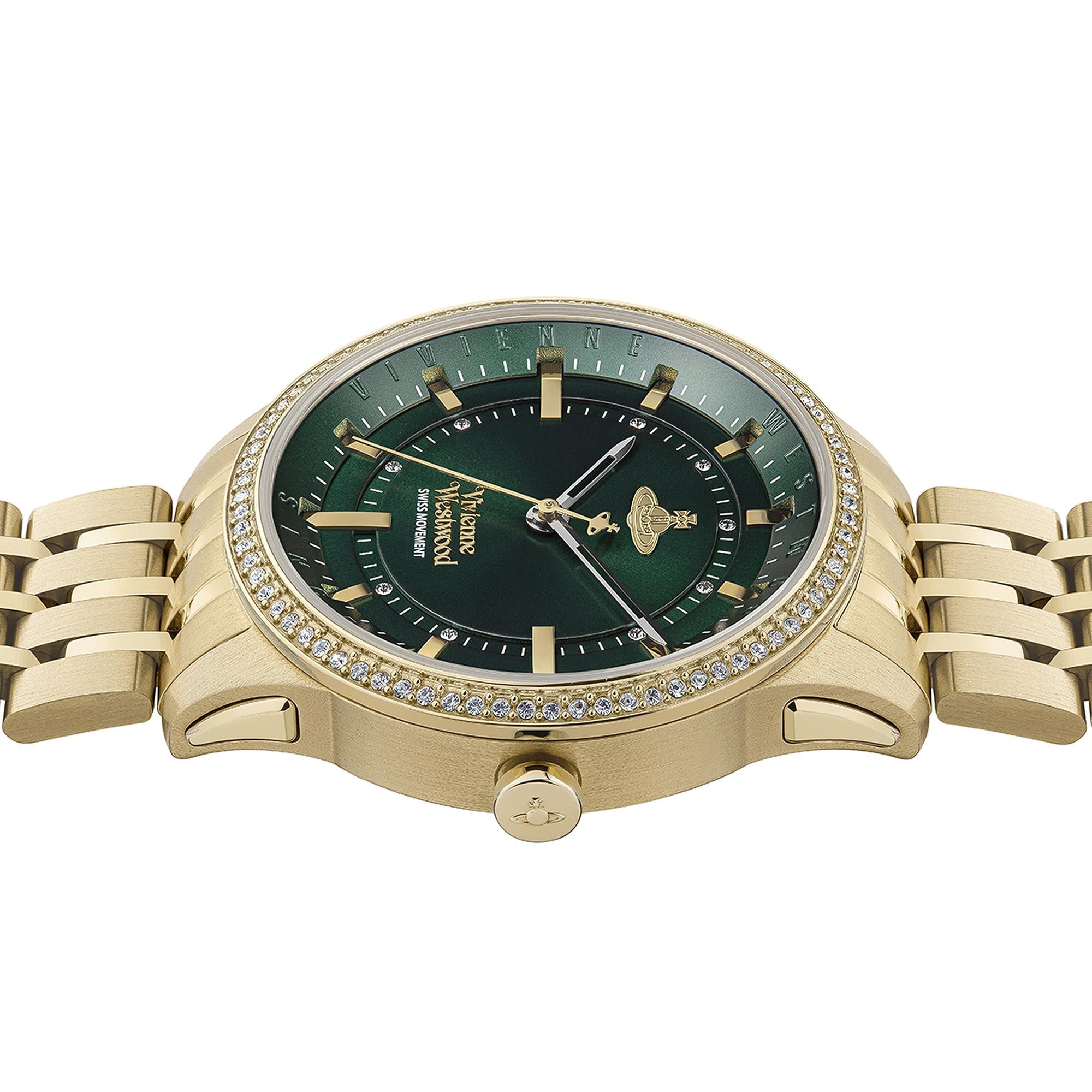 Angled view of gold-tone bracelet and crystal bezel with green and black layered dial