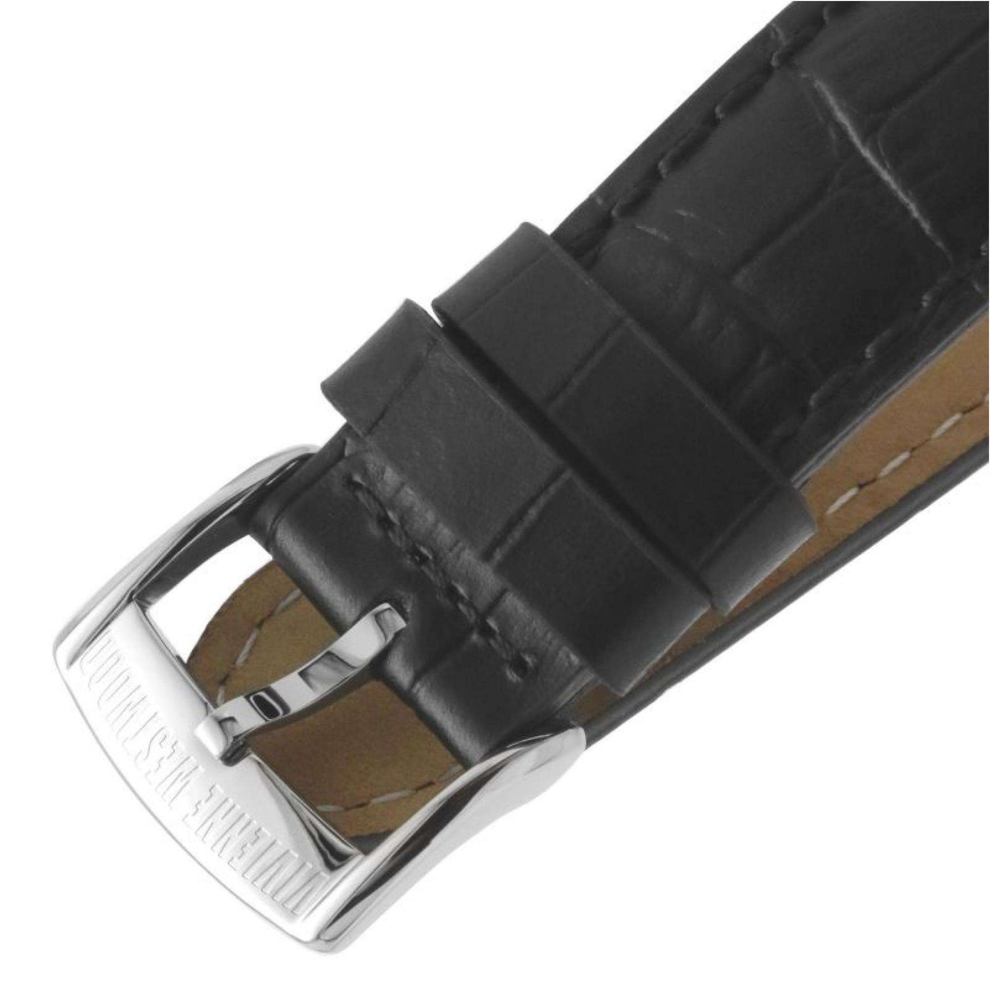 Black leather strap detail with crocodile texture, silver buckle, and tan suede interior