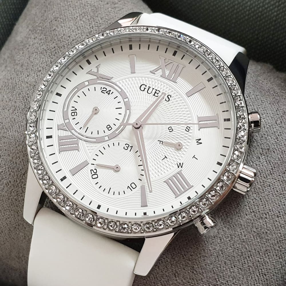 Guess W1135L7 ladies solar chronograph on wrist with white strap and silver dial