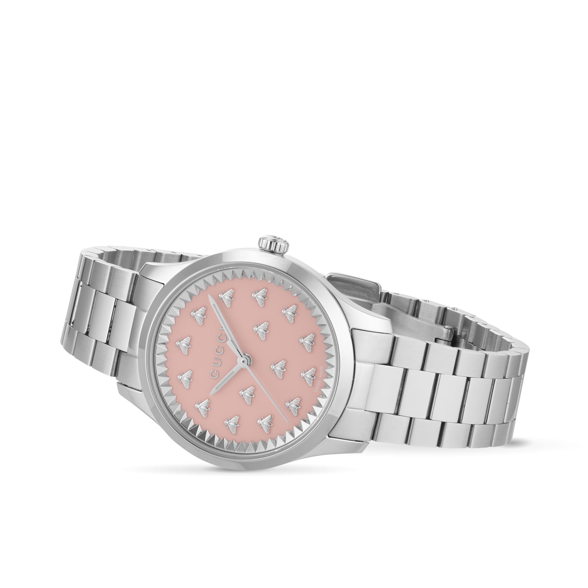Gucci G-Timeless women's watch on wrist displaying pink dial with bee pattern and steel bracelet