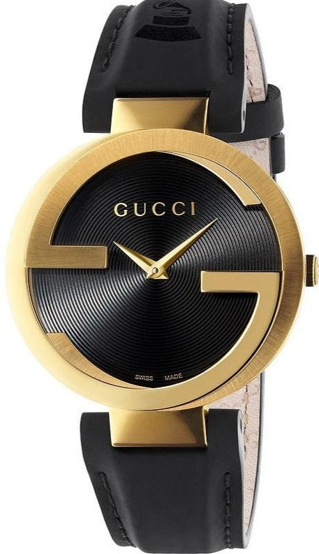 Gucci Interlocking G Grammy watch with gold-tone case and black dial featuring Gucci branding and hands